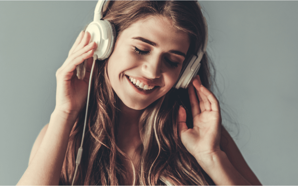 Someone smiling while listening to a personalized birthday song