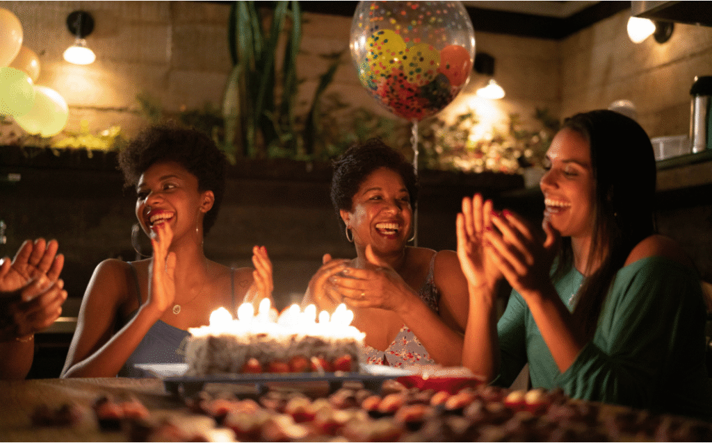 Friends and family celebrating with a personalized birthday song