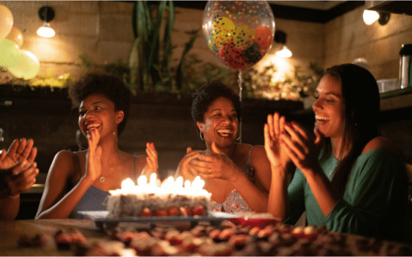 Friends and family celebrating with a personalized birthday song